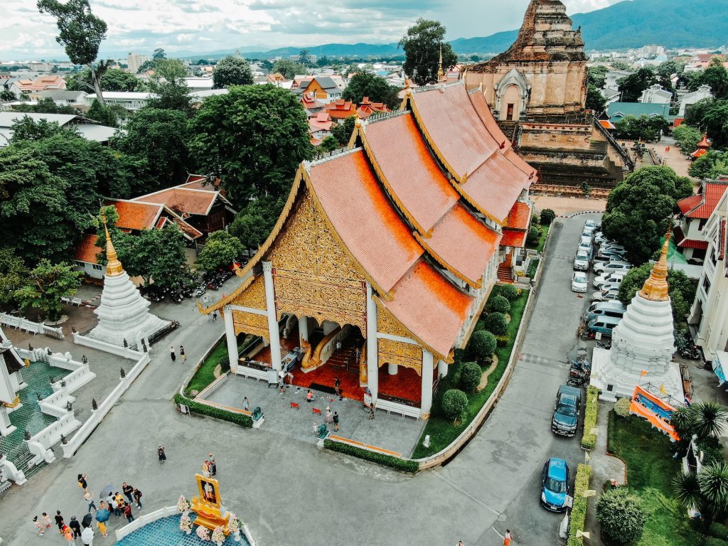 architectural design of an orange temple roof. travel photos from a digital nomad. Photo by Tim Durgan: https://www.pexels.com/photo/architectural-design-of-an-orange-temple-2956618/